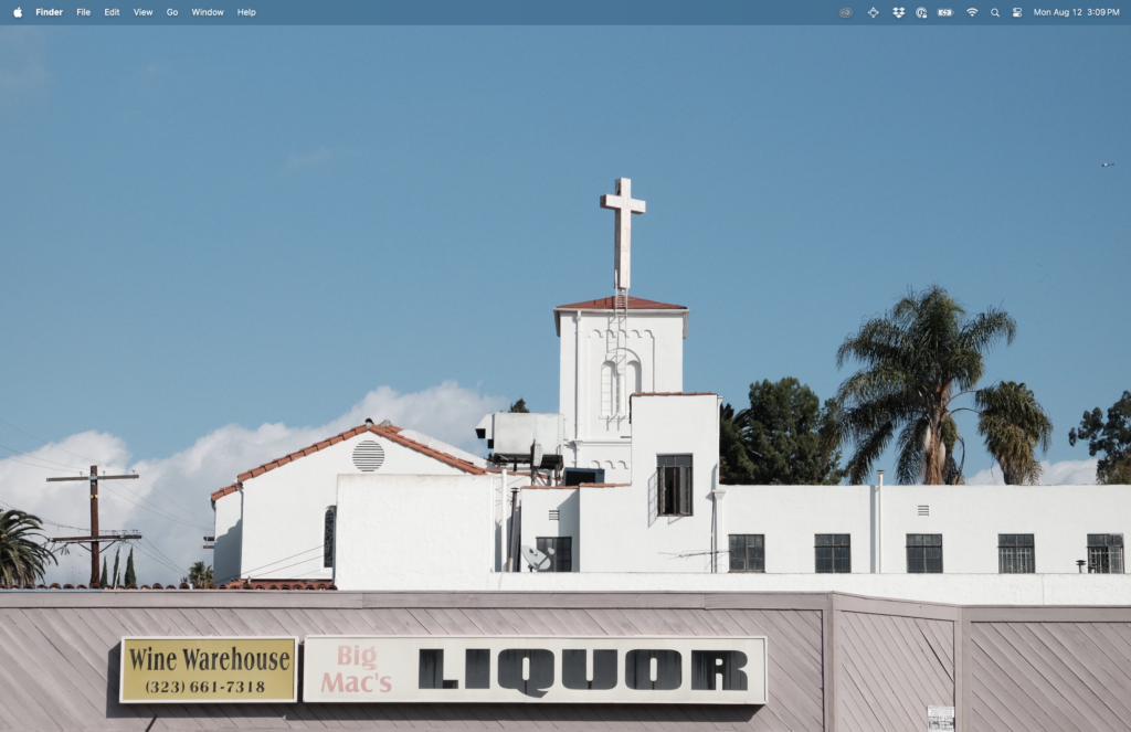 Screenshot of a mac desktop with dock hidden and photo of a church in front of a Liquor sign